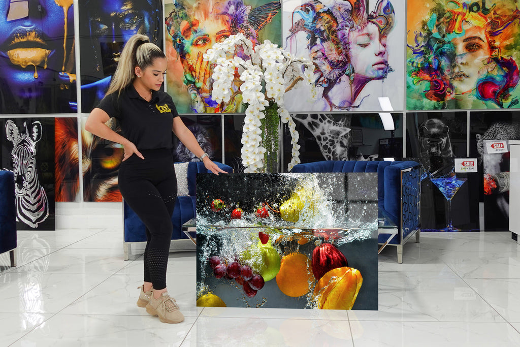 Acrylic design with fruits falling into the water..