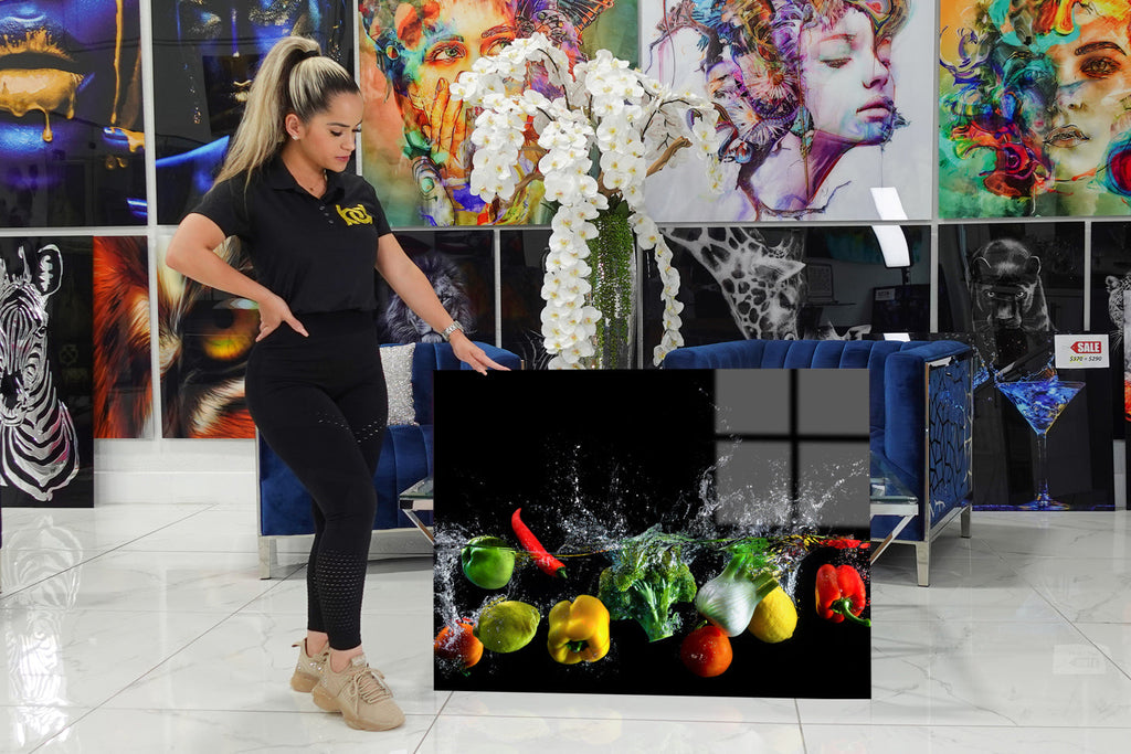Very decorative acrylic with vegetables falling into the water.